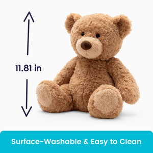 Brown AI toy teddy bear with measurement label and text about surface-washability on a white background