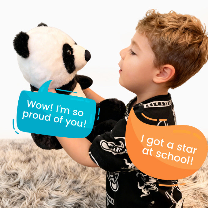 Child holding TalkiPal AI panda plush toy with text bubbles indicating pride and school achievement.