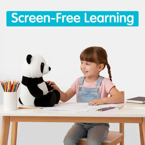 Child sitting at a table with a panda plush toy, engaged in screen-free learning.